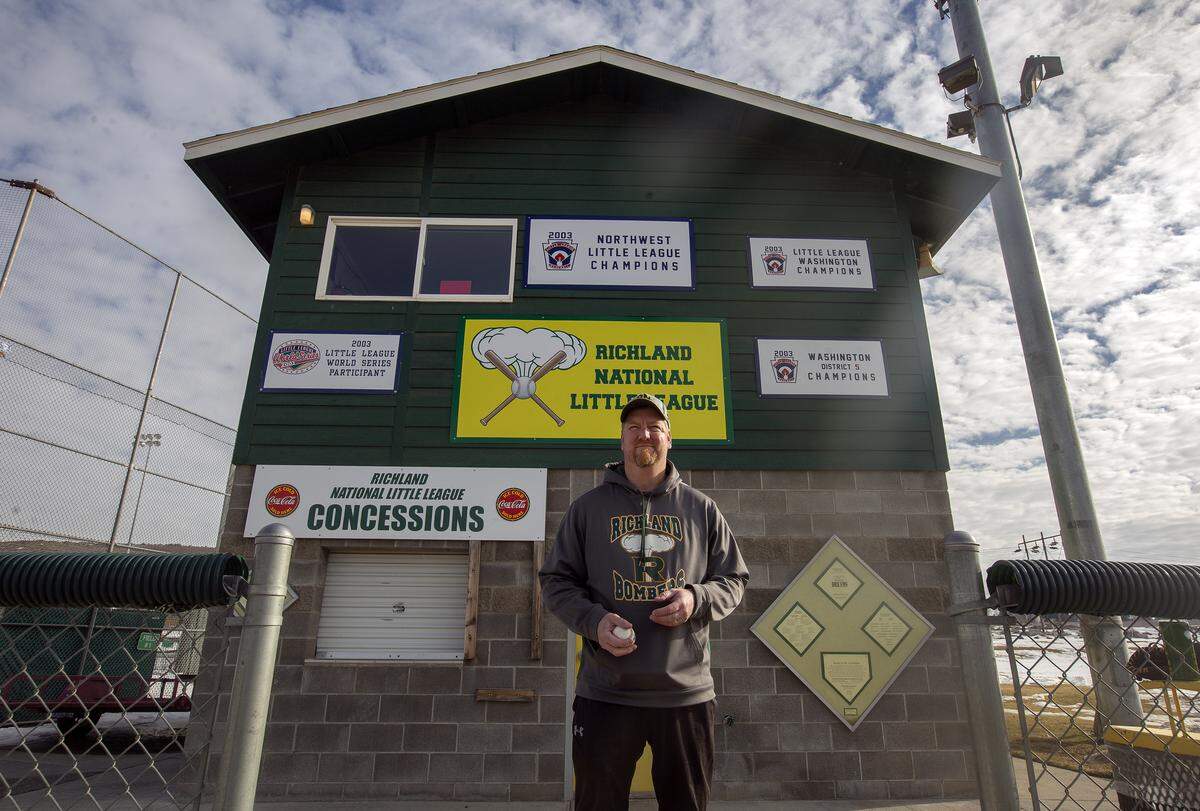 Richland National Little League president Scott Revell stands outside the clubhouse at Badger Mountain Community Park in Richland. Some Little League baseball and softball managers worry Richland’s new fee agreements could raise costs to families.