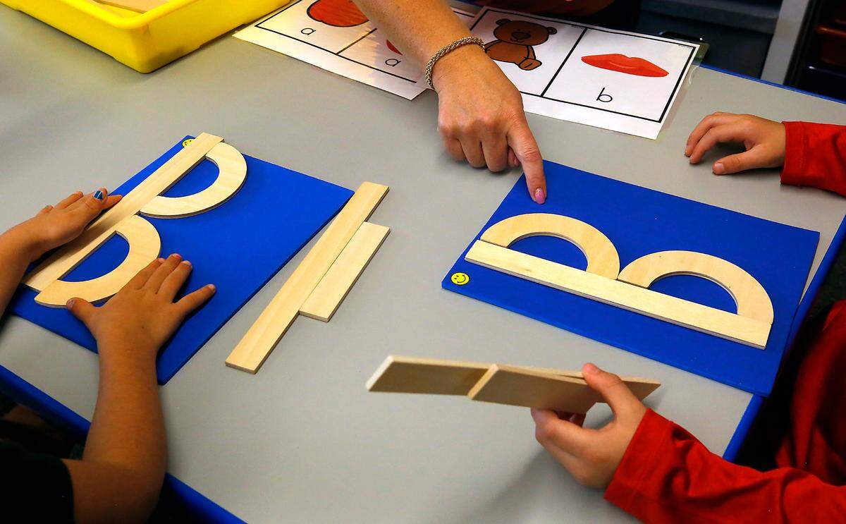 Kindergarten teacher Toni Cuello works with a group of her Desert Sky Elementary students in the West Richland school.