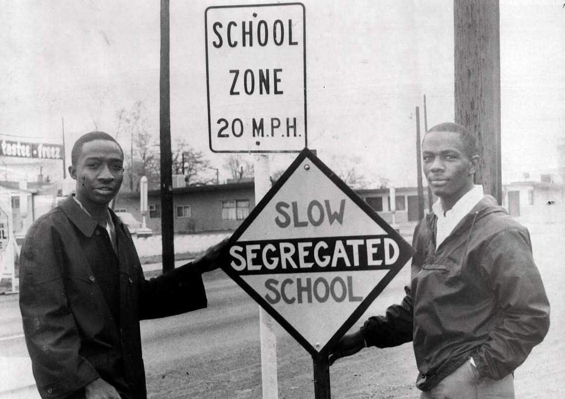 Wallace Webster, left, and Larry Avery protested the de facto segregation at Whittier School in east Pasco in 1964. They posted the segregated school sign in front of the Lewis Street school.