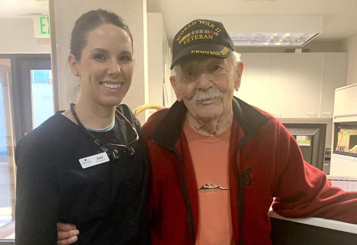Bill Malley, a Richland pharmacist who joined the U.S. military at 17 in 1943, posed with his dental hygienist at age 97 in 2022.