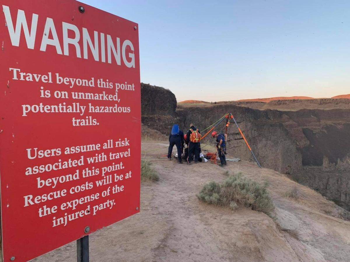 Emergency crews with Franklin County Fire District 3 and other agencies work to rescue a hiker at Palouse Falls.