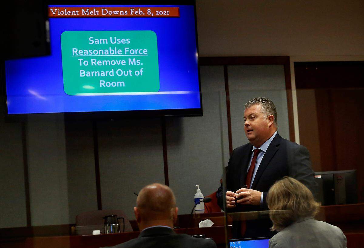 Defense attorney Scott Johnson uses computer presentation for his opening statement to the jury Tuesday morning during the domestic violence trial of Judge Sam Swanberg, a Benton-Franklin Superior Court judge. Yakima County District Court Judge Donald Engel is presiding at the trial being held in Franklin County.