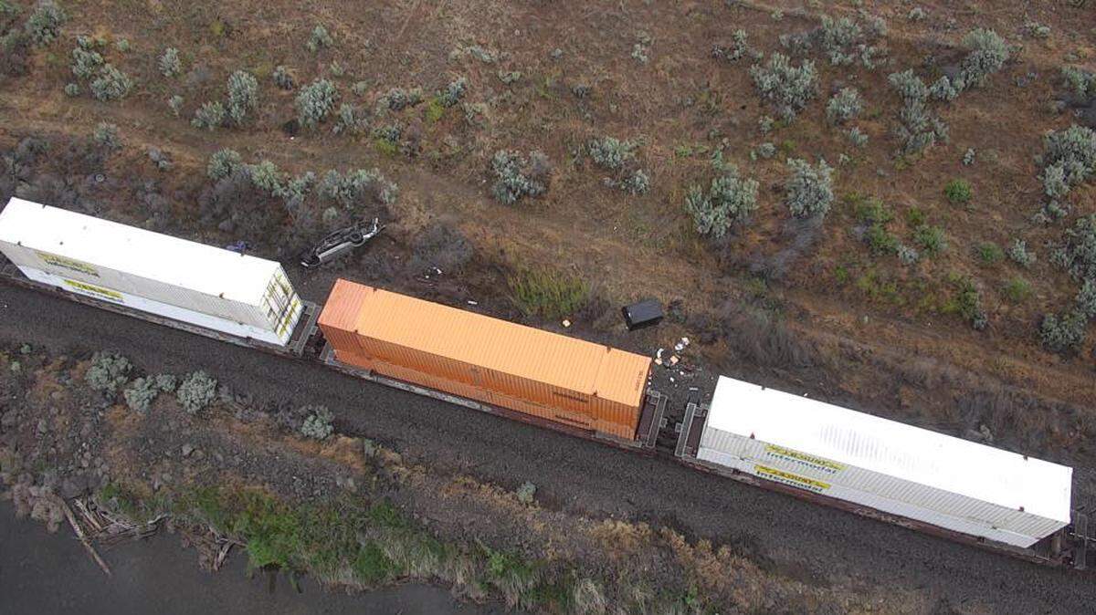 A train hit a pickup with a man sleeping inside along the Columbia River early Monday.