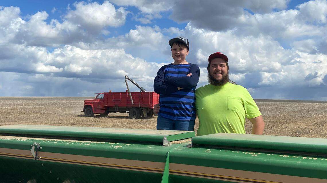 Christopher Wiley, right, and his brother Jonathan seeding spring wheat on Cemetery Road in the Horse Heaven Hills. Wiley says Scout Clean Energy wind farm would benefit small farms in the region, helping to keep farms in the family for many generations to come.