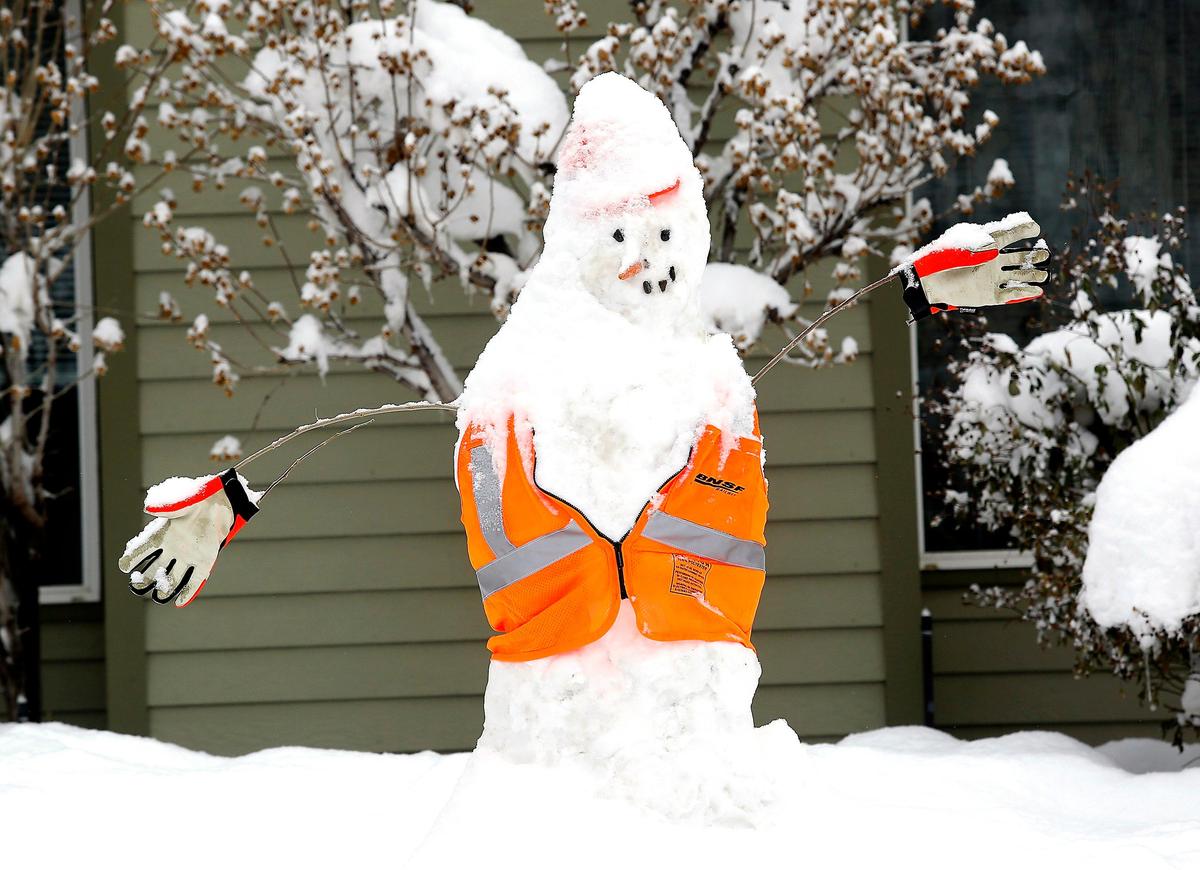 A safety oriented snowman sits in the front yard of Jennifer and Jon Leslie’s home in the Kennewick Park housing subdivision. The Kennewick man said his four children, three girls and one boy between the ages of 12 and 2, pitched in to help create the frosty sculpture.