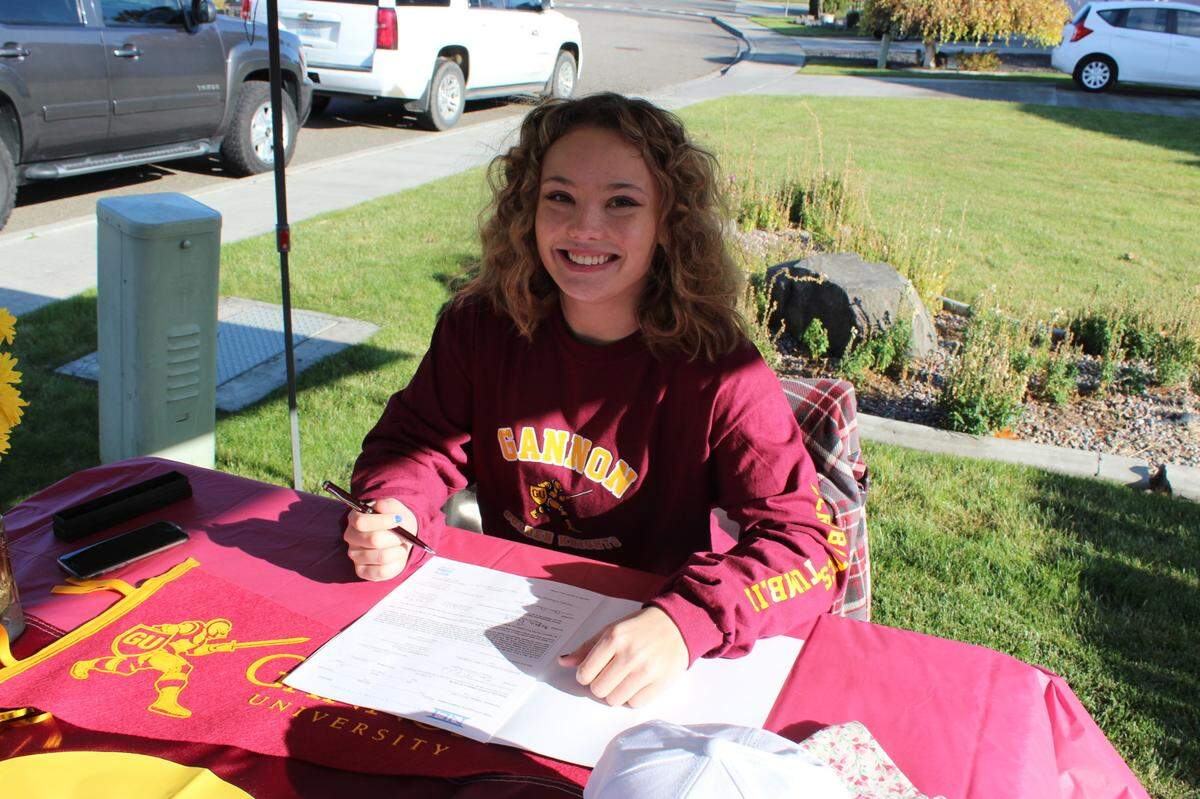 Richland High senior Megan Revell signed a letter of intent last week to compete for Gannon University’s acrobatics and tumbling team.