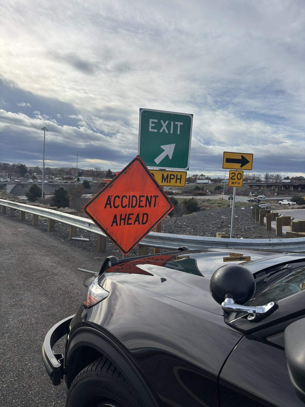 A pickup crashed through a Highway 395 work site and left four state road workers hurt.