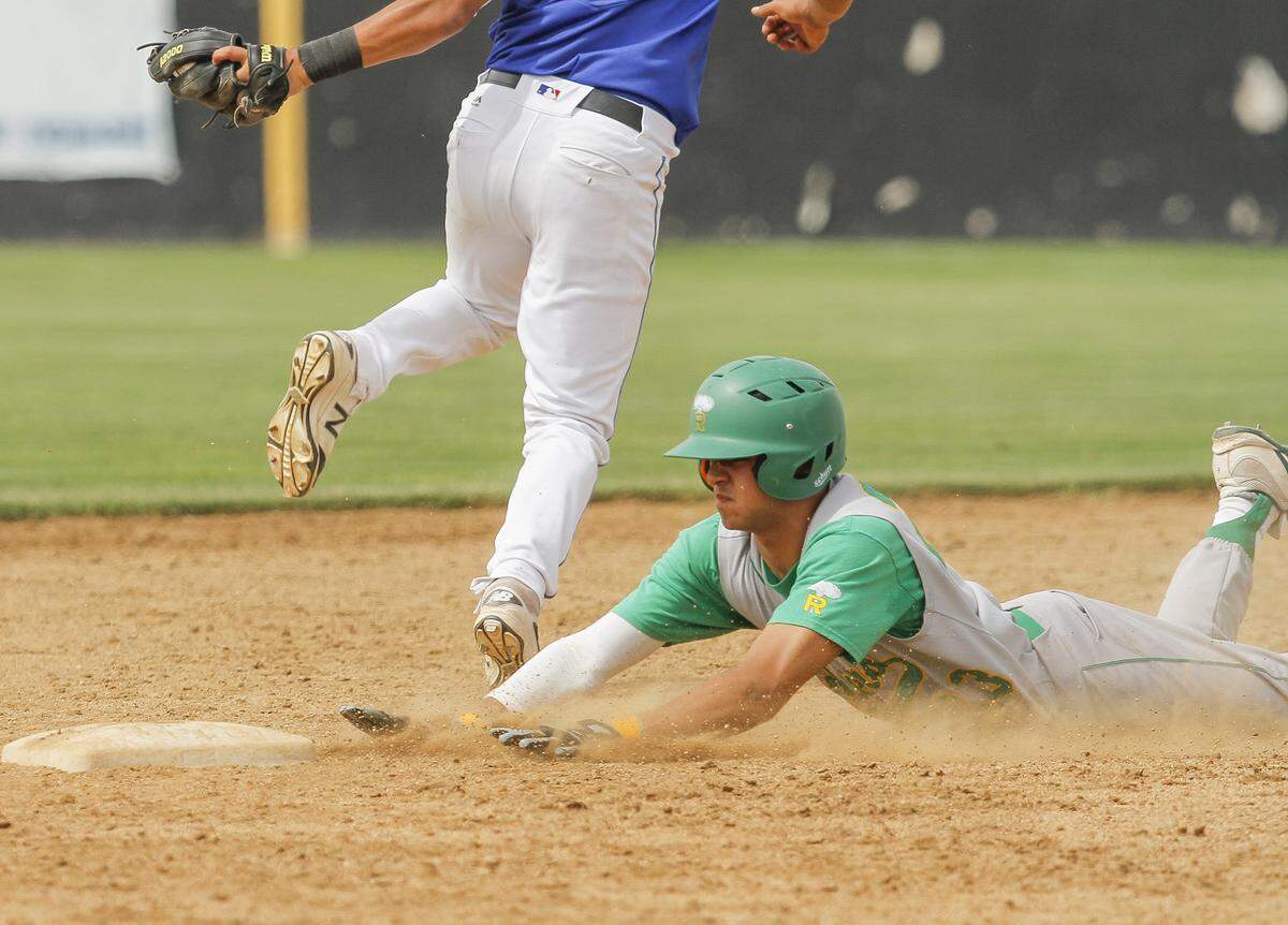 Richland’s Josh Mendoza slides into second base during a 4A state semifinal game against Federal Way on Friday at Gesa Stadium in Pasco.