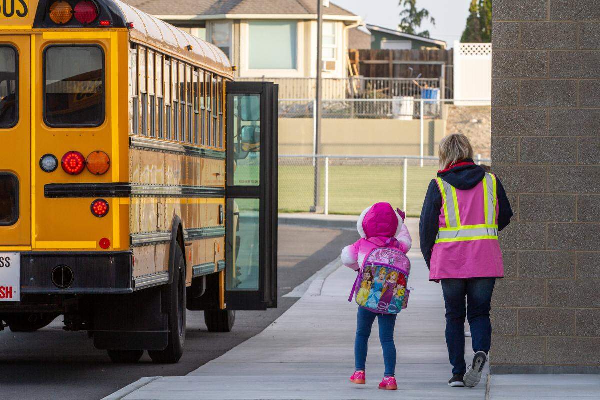 Kindergarten students arrive at TapTeal Elementary in West Richland.