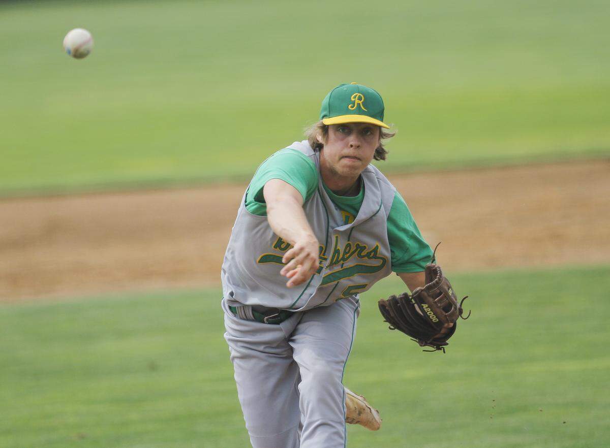 Richland’s Caleb Richter (5) pitches during the 4A state semifinals Friday against Federal Way at Gesa Stadium in Pasco. Richland won 11-0.