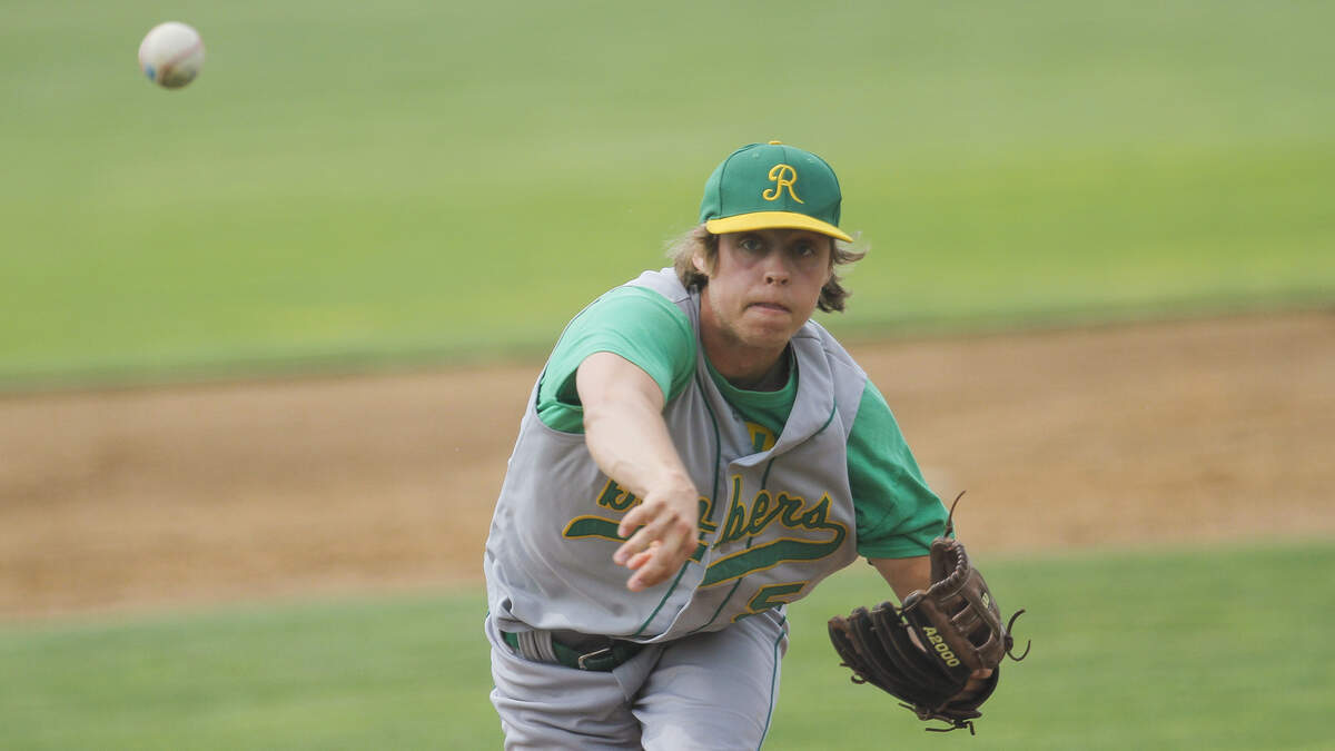 Richland’s Caleb Richter (5) pitches during the 4A state semifinals Friday against Federal Way at Gesa Stadium in Pasco. Richland won 11-0.