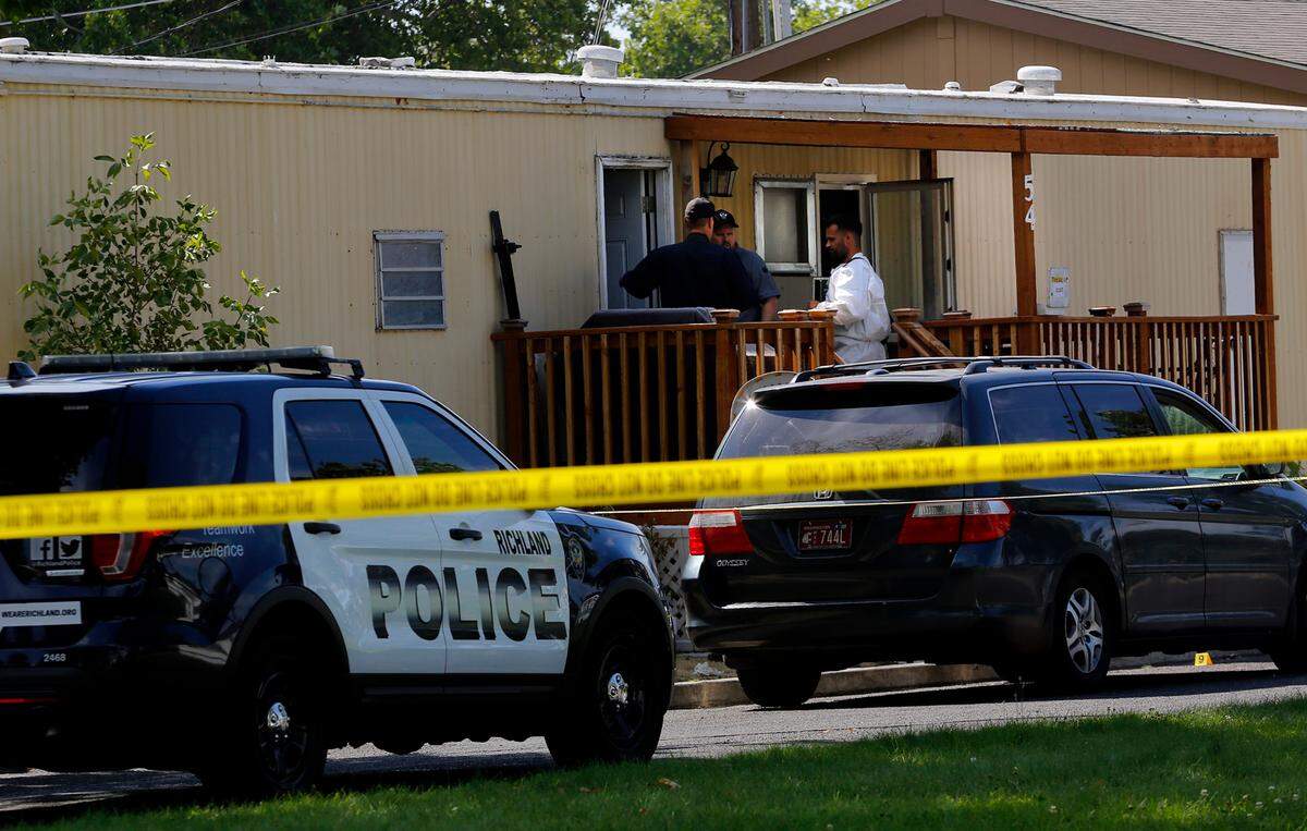Richland police detectives investigate the deadly double stabbing crime scene Wednesday morning at 54 Cosmic Lane in north Richland. The victims, a man and Bethany Lowe, were taken to Kadlec Regional Medical Center in Richland. She died there and the man was in serious condition with multiple stab wounds, according to police officials.