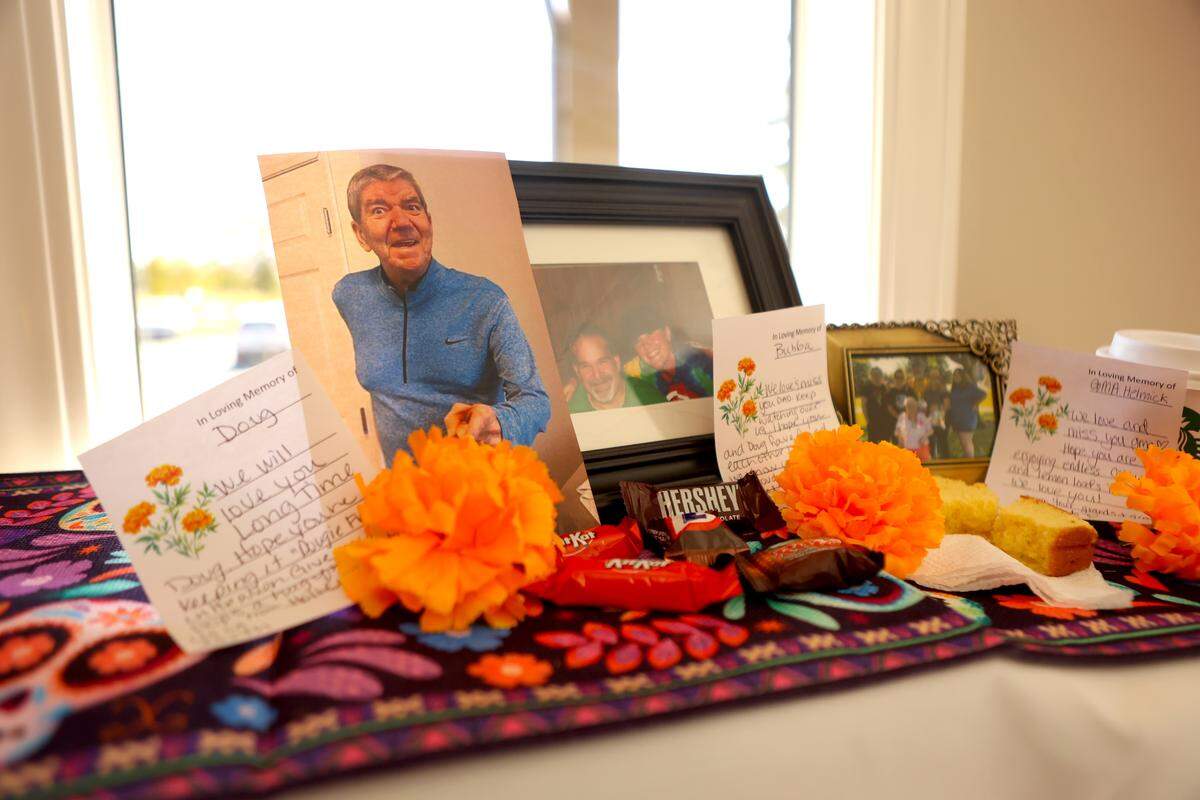 Three photos take up a section of the community altar at Einan’s at Hillcrest Pasco celebrating Day of the Dead.