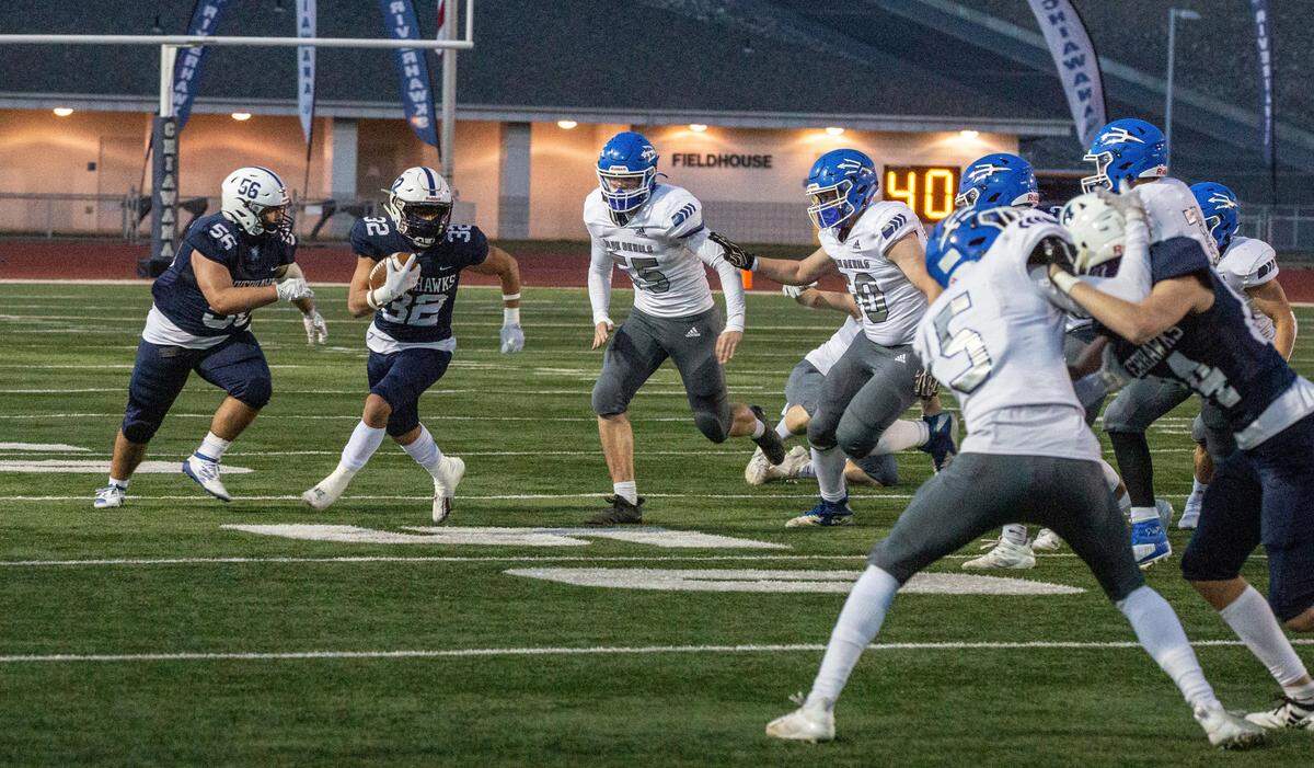 Chiawana running back Aiden Villarreal moves the ball down the field in a game against Walla Walla at Edgar Brown Memorial Stadium on Friday, March 19. The Riverhawks beat the Blue Devils 35-7.