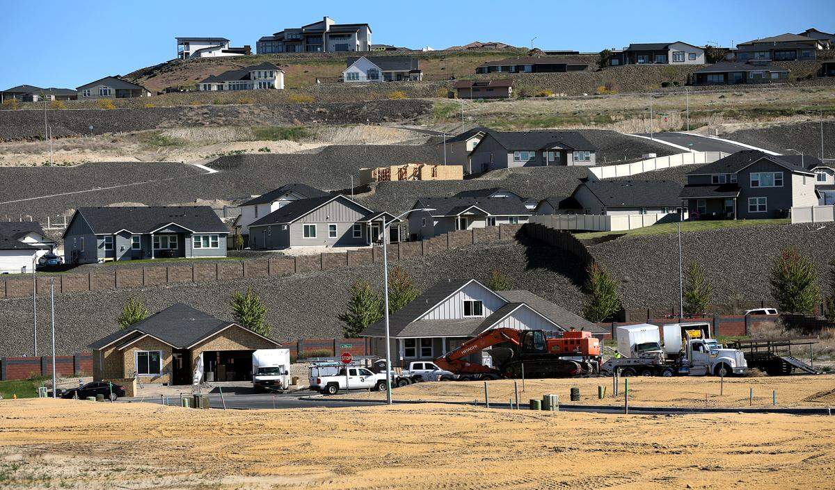 Open lots, houses under construction and completed homes in the new Apple Valley and Sherman Heights housing developments off the Bob Olson Parkway in the Southridge area of Kennewick.