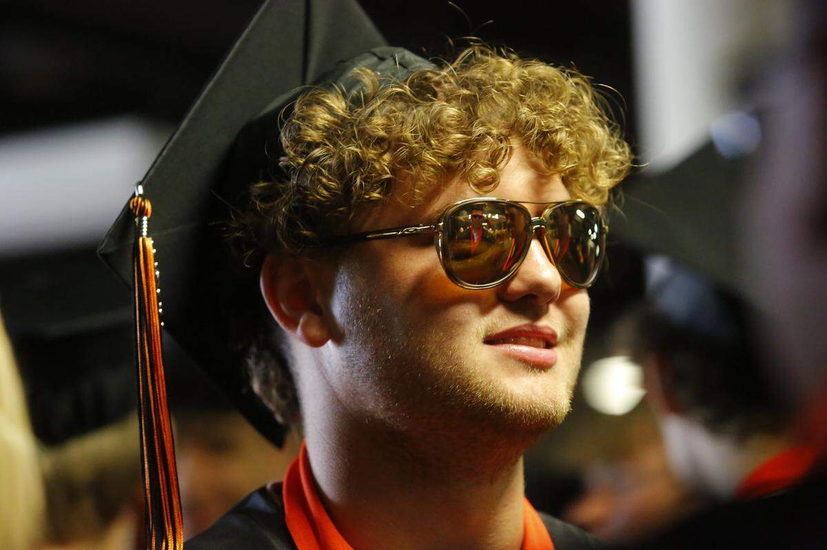 Family and friends fill the Toyota Center to watch 350 Kennewick High School graduates receive diplomas during the school’s 115th commencement ceremony.