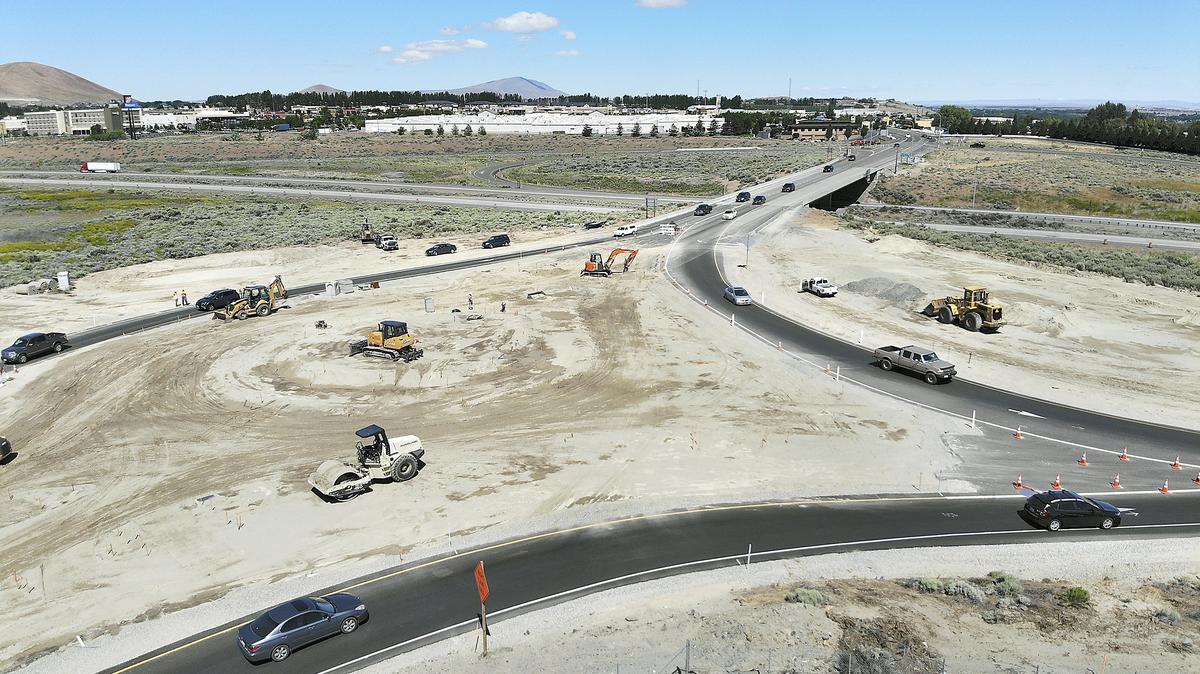 Motorists make their way through detours around construction activity Monday morning at the new roundabout being built near the Queensgate ovperass spanning Interstate 182 in Richland.