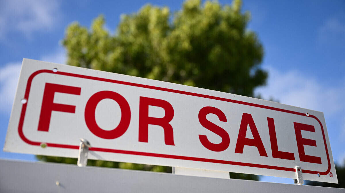 Generic stock photo of a home for sale sign - house for sale