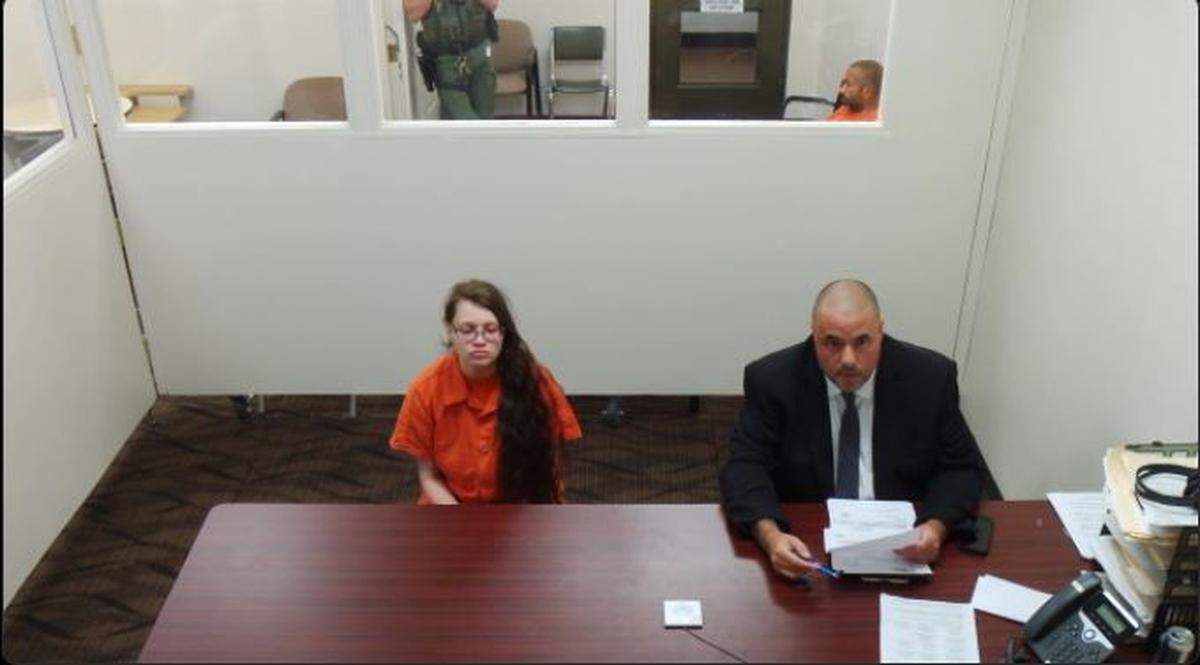 Adriana Rivas sits next to her attorney Tim Dickerson in Franklin County Superior Court on Tuesday, Aug. 29. She is accused of beating her 6-year-old daughter with an HDMI cable and then leaving her in her apartment.
