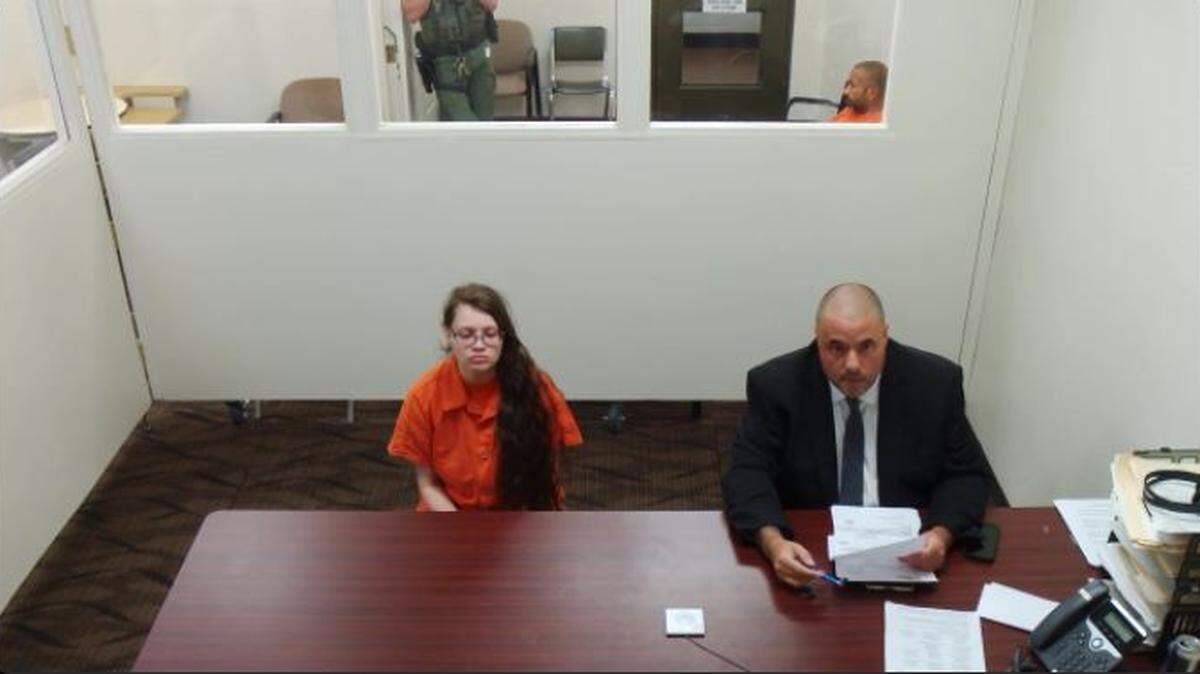 Adriana Rivas sits next to her attorney Tim Dickerson in Franklin County Superior Court on Tuesday, Aug. 29. She is accused of beating her 6-year-old daughter.