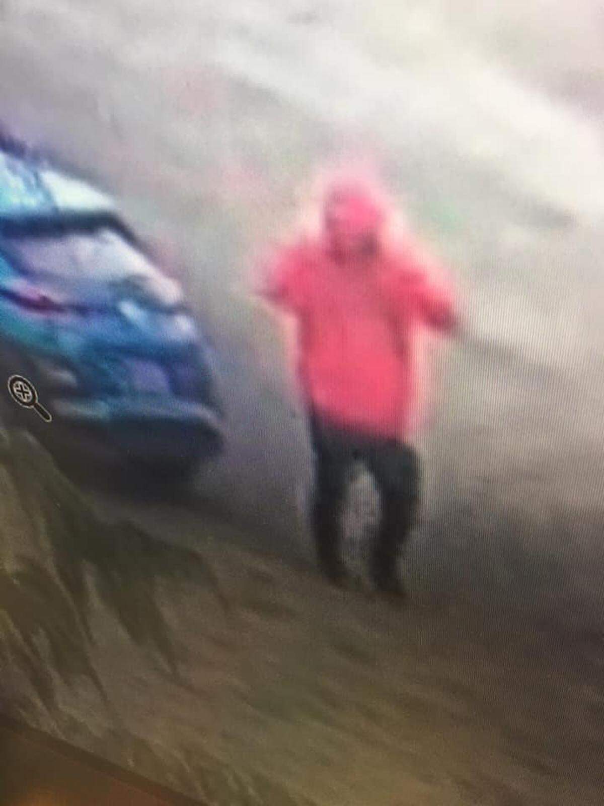 A robber was wearing a pink shirt when she switched cars near Second Avenue and Clark Street in Pasco.