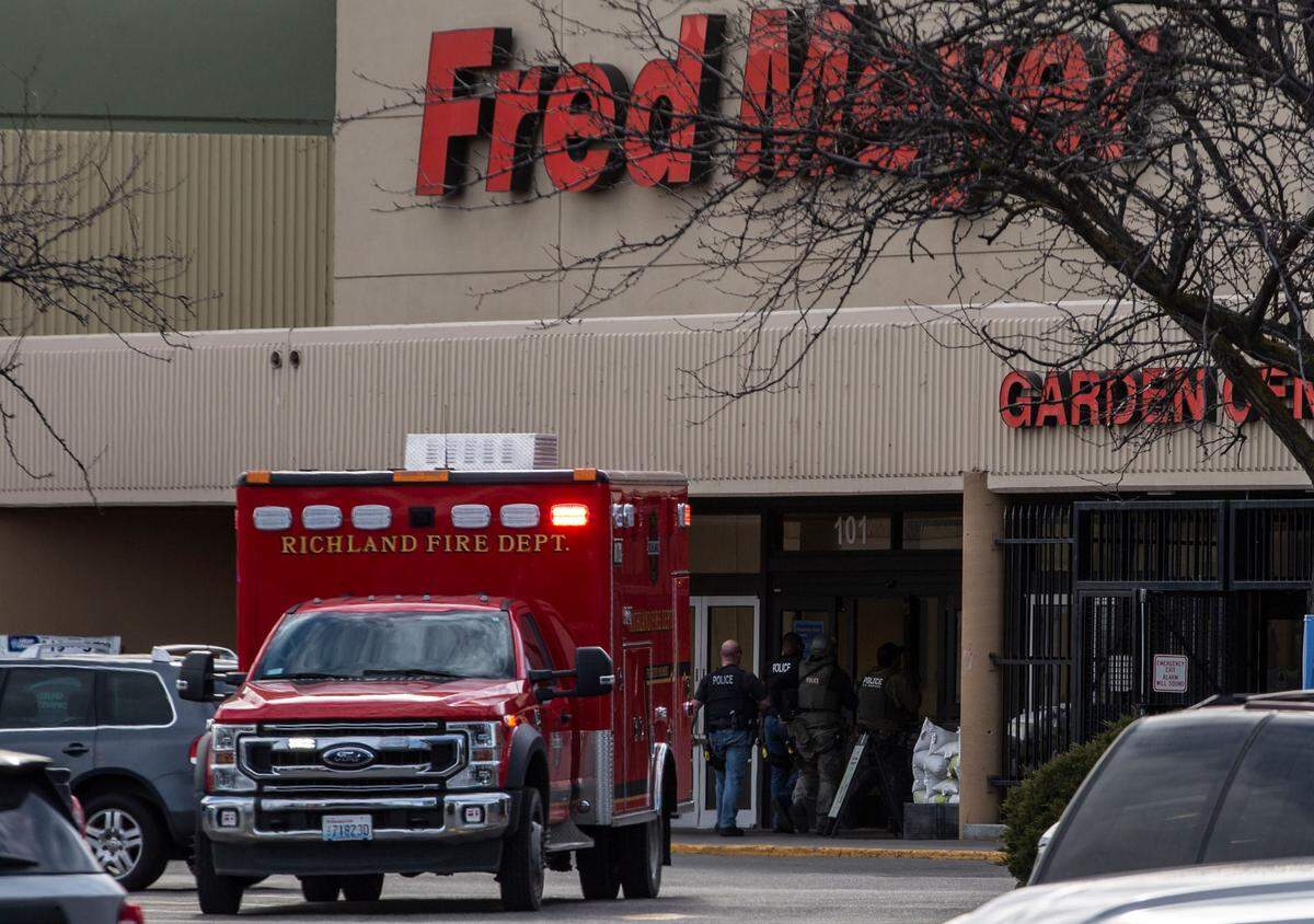 Law enforcement enters Fred Meyer in Richland, WA. A gunman killed one shopper and injured an employee late Monday morning. 
