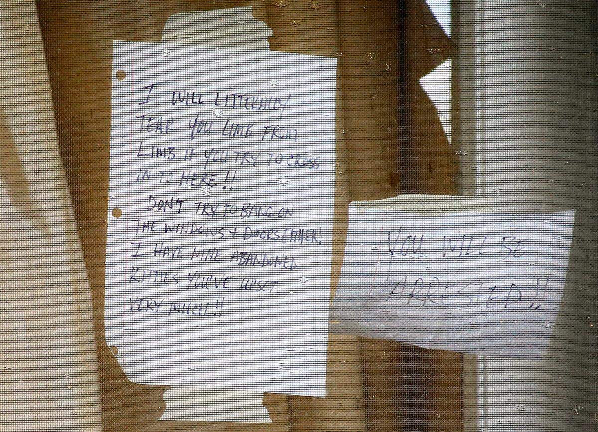 Richland police are investigating the death of a woman inside this duplex at 1421 Mahan Avenue who possibly died several weeks before she was found. A couple of threatening handwritten notes are still taped to the front screen door.