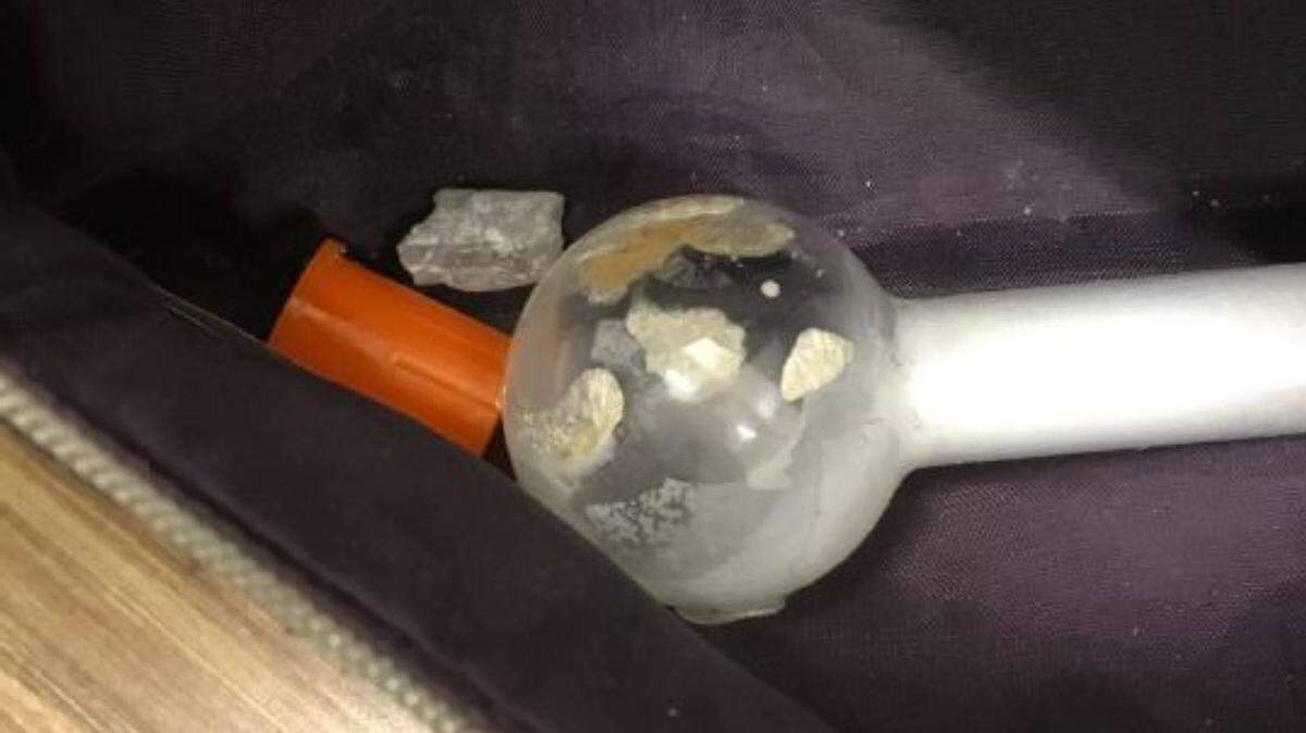 Pasco police officers found a meth pipe in the purse of a Vancouver woman after she crashed a car at Fourth Avenue and Columbia Street.