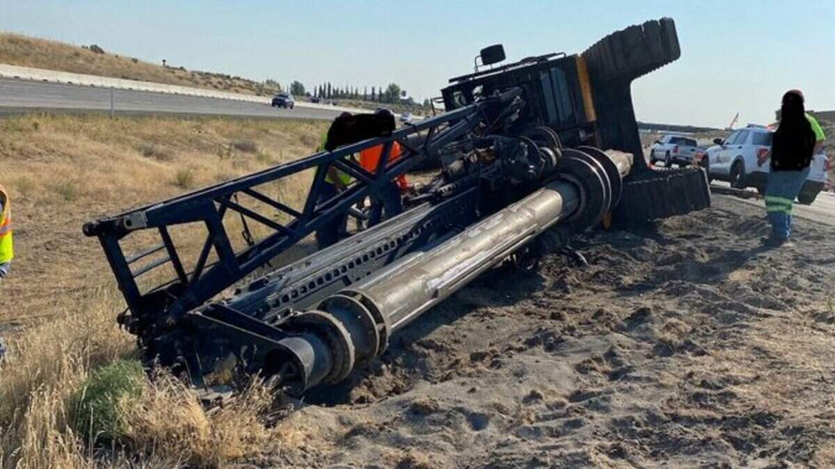 A crane toppled in the median of Interstate 182. A crane will need to be brought in to fix it.