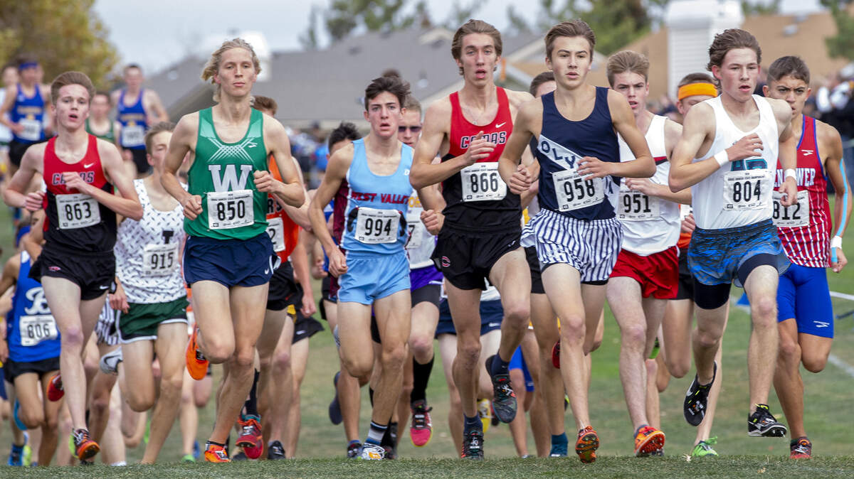 Olympia’s Connor Griffith (958) competes in WIAA 4A boys cross country state championship at Sun Willows Golf Course in Pasco on Saturday. Griffith took twelfth place with a time of 15:43.10.
