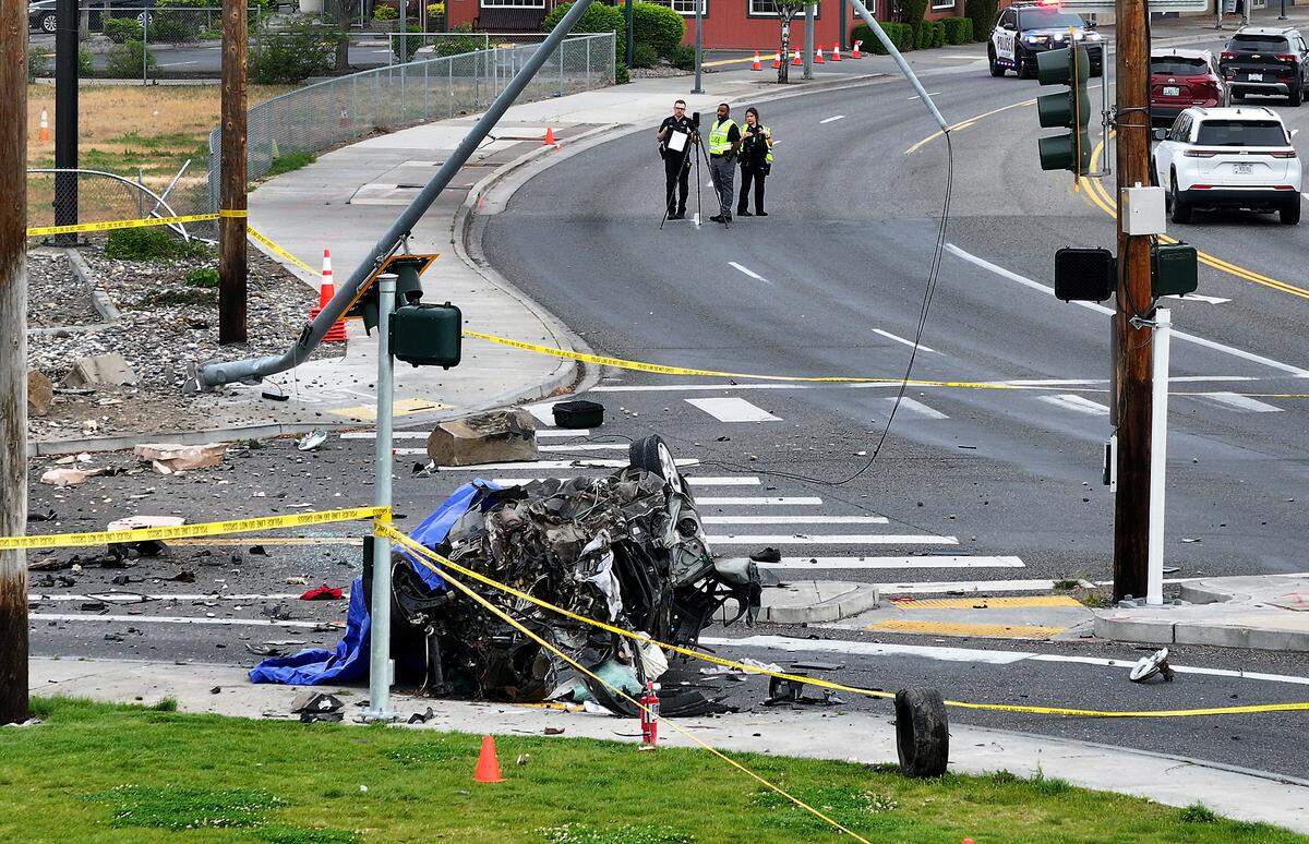 The car was demolished when it crashed into a metal streetlight at the corner of Jadwin Avenue and hit a basalt column sign. 
