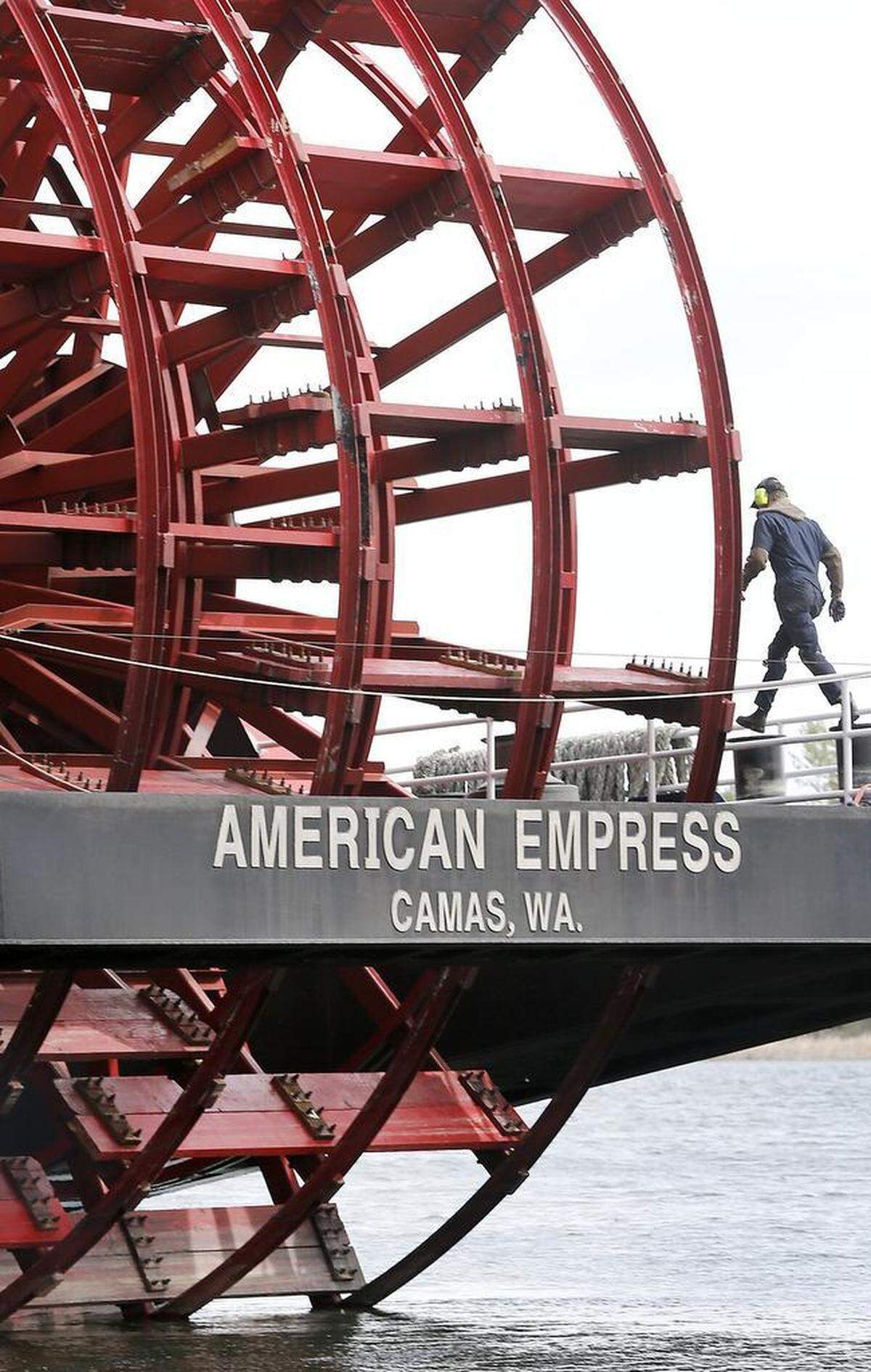 A deck hand on the 360-foot diesel-powered paddle wheeler American Empress walks past the ship’s propulsion assembly while performing work on the vessel in Richland in 2015.