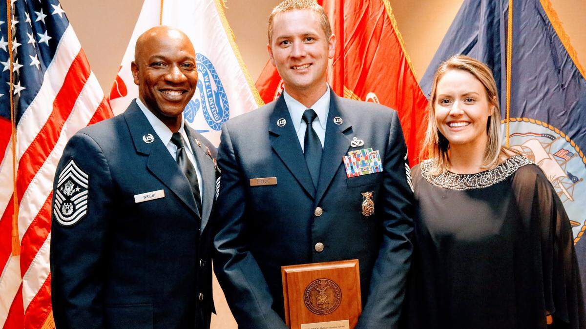 Chief Master Sergeant of the Air Force Kaleth O. Wright with honoree Master Sgt. Christopher Engelke and his wife Jenna-Brie.