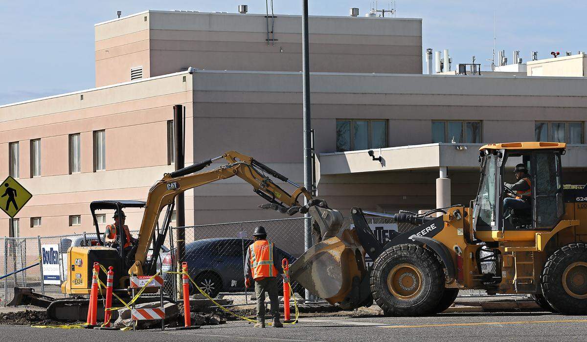 Construction crews work on the sidewalks outside the former Kennewick General Hospital, the future home of the Columbia Valley Center for Recovery.