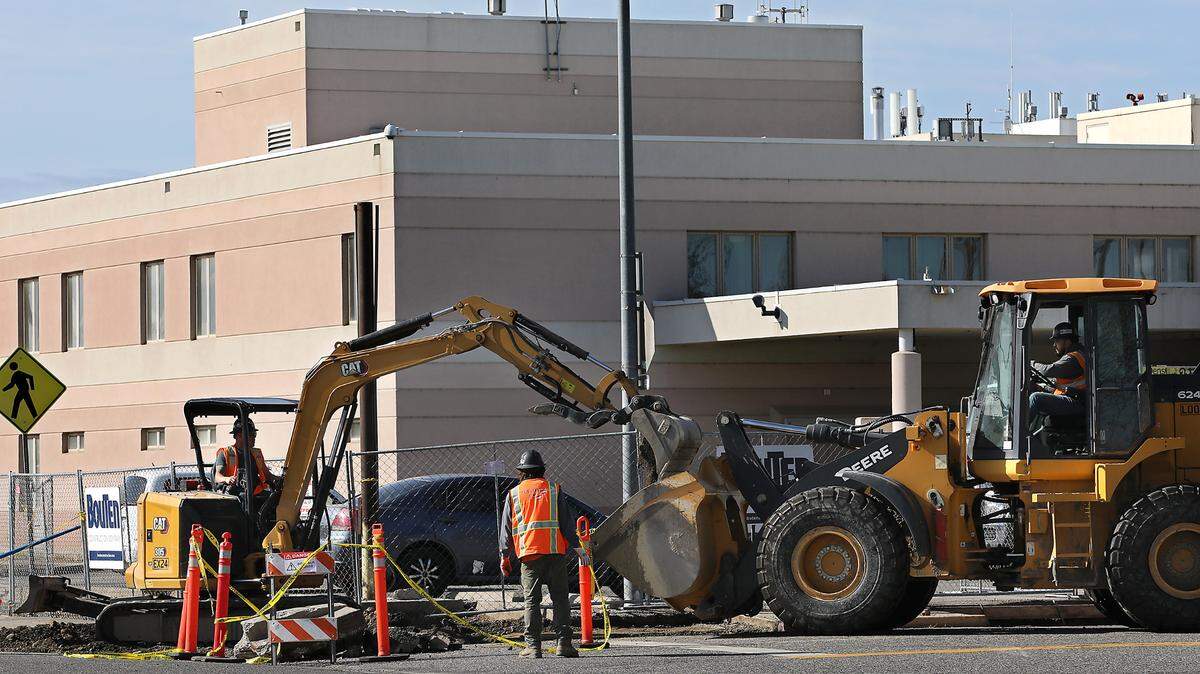 Construction crews work on the sidewalks outside the former Kennewick General Hospital, the future home of the Columbia Valley Center for Recovery.
