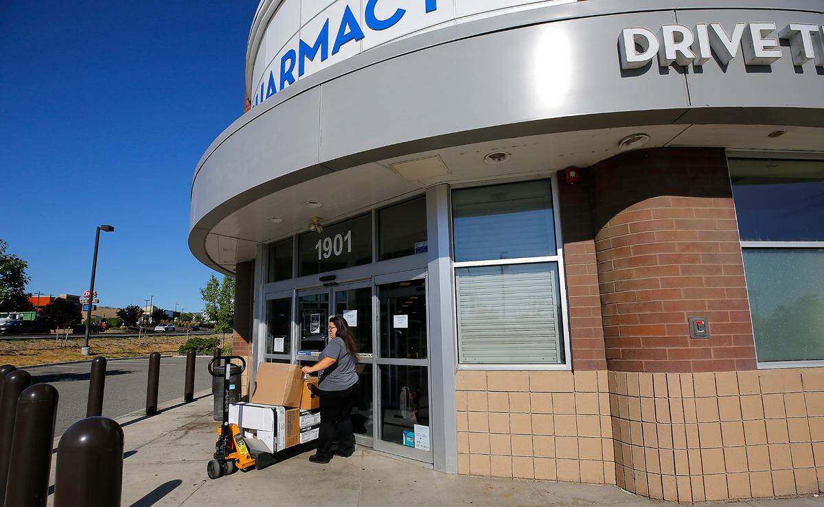 An employee uses a pallet jack to remove supplies from the recently closed Rite Aid Pharmacy at 1901 N. Steptoe St. in Kennewick. The bankrupt pharmacy is closing at least three of its five Tri-Cities locations, according to court documents.