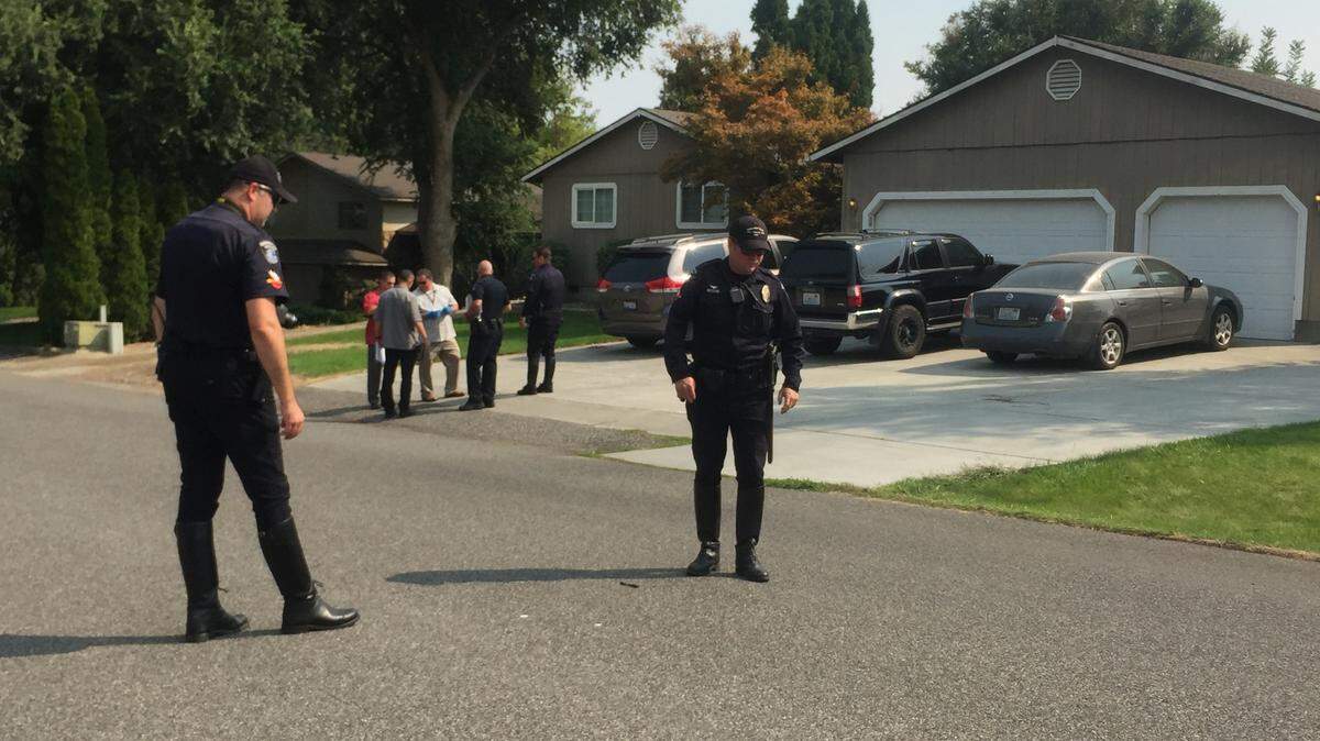 Kennewick police search the area for clues after a hit-and-run on Belfair Street Sept. 5.