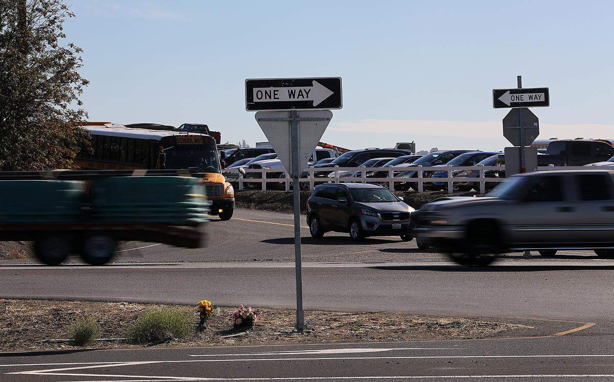 Flowers have been placed as a memorial for the Kennewick mother and daughter killed last week in a crash at the Highway 395 intersection with Selph Landing and Crestloch Roads near Pasco.