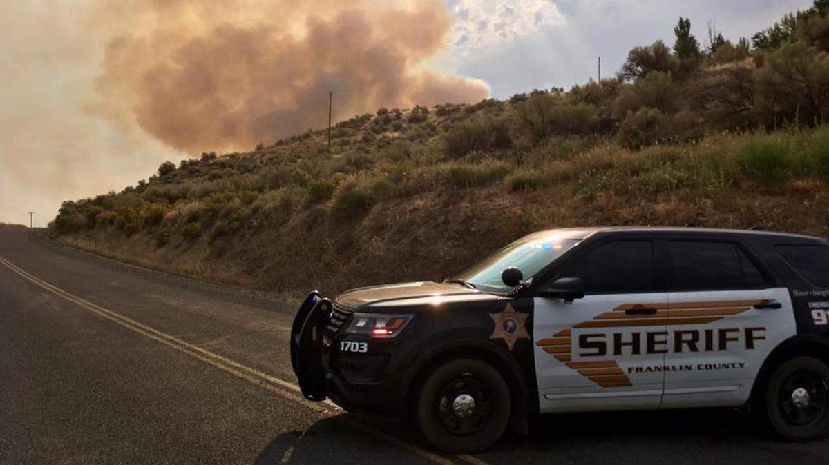 A fire is burning near Blanton and Smith Canyon roads near Eltopia. The smoke is visible from Highway 395.