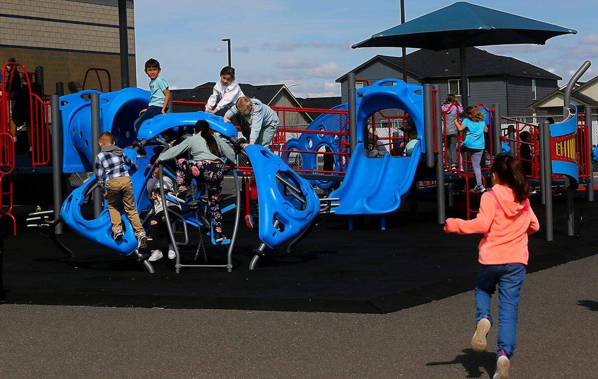 Students flock to the playground at Three Rivers Elementary in Pasco, which has been ranked in the top 10 inclusive school playgrounds in the United States.