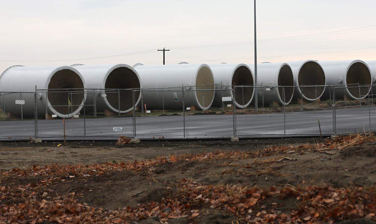 Cylindrical equipment staged for construction project adjacent to the Kennewick wastewater treatment facility.