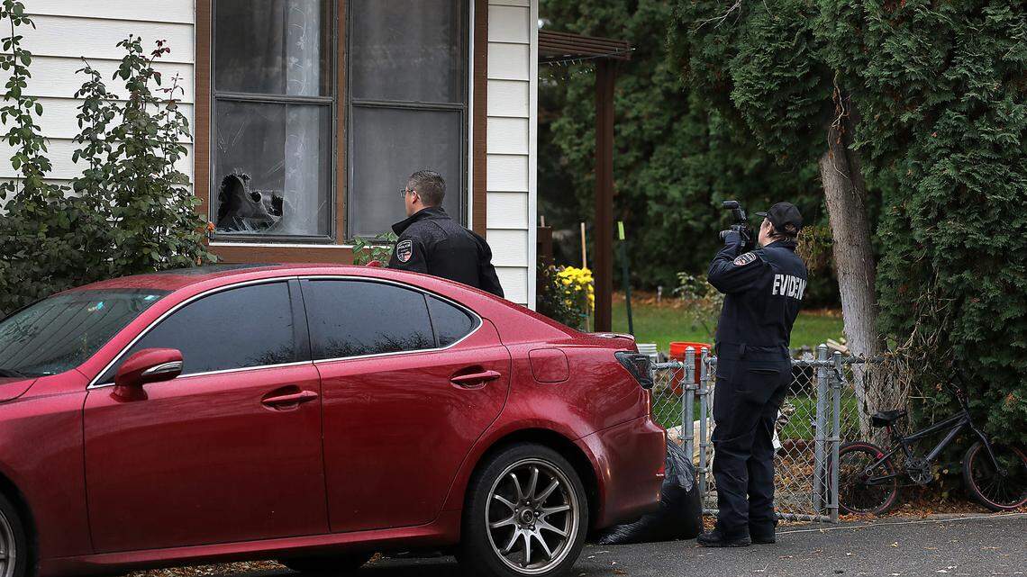 Investigators for the West Richland Police Department document the scene of Monday’s early morning drive-by shooting on Meyers Street.