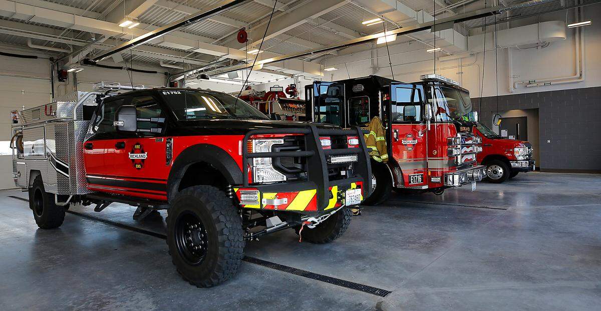 Fire trucks and ambulance parked in the new Richland Fire Department Station 76.