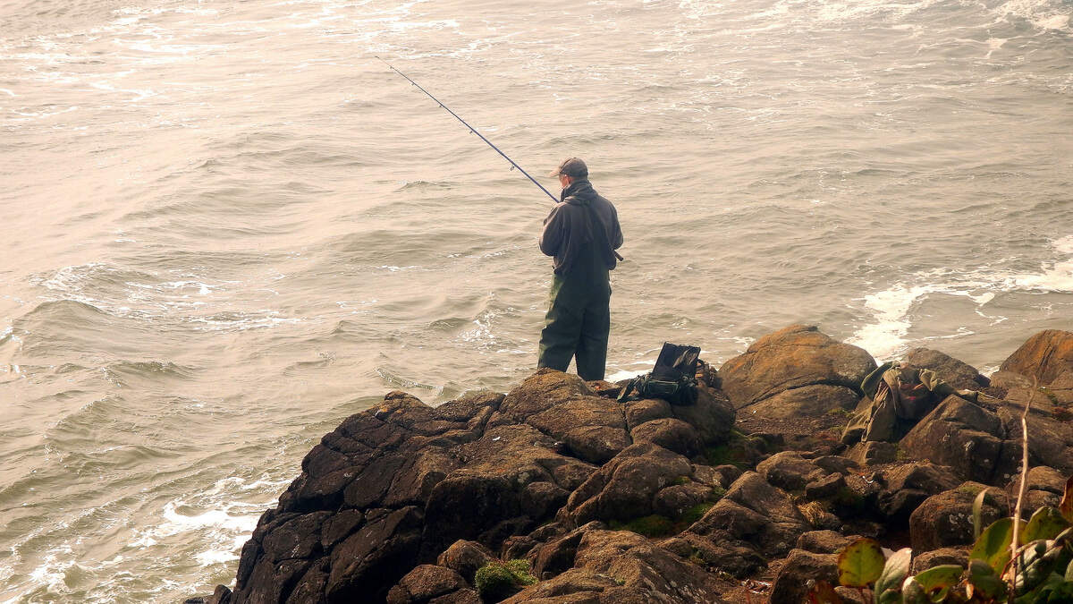 The author casts from a safe rock on the Oregon Coast, hoping to hook a tasty surfperch.