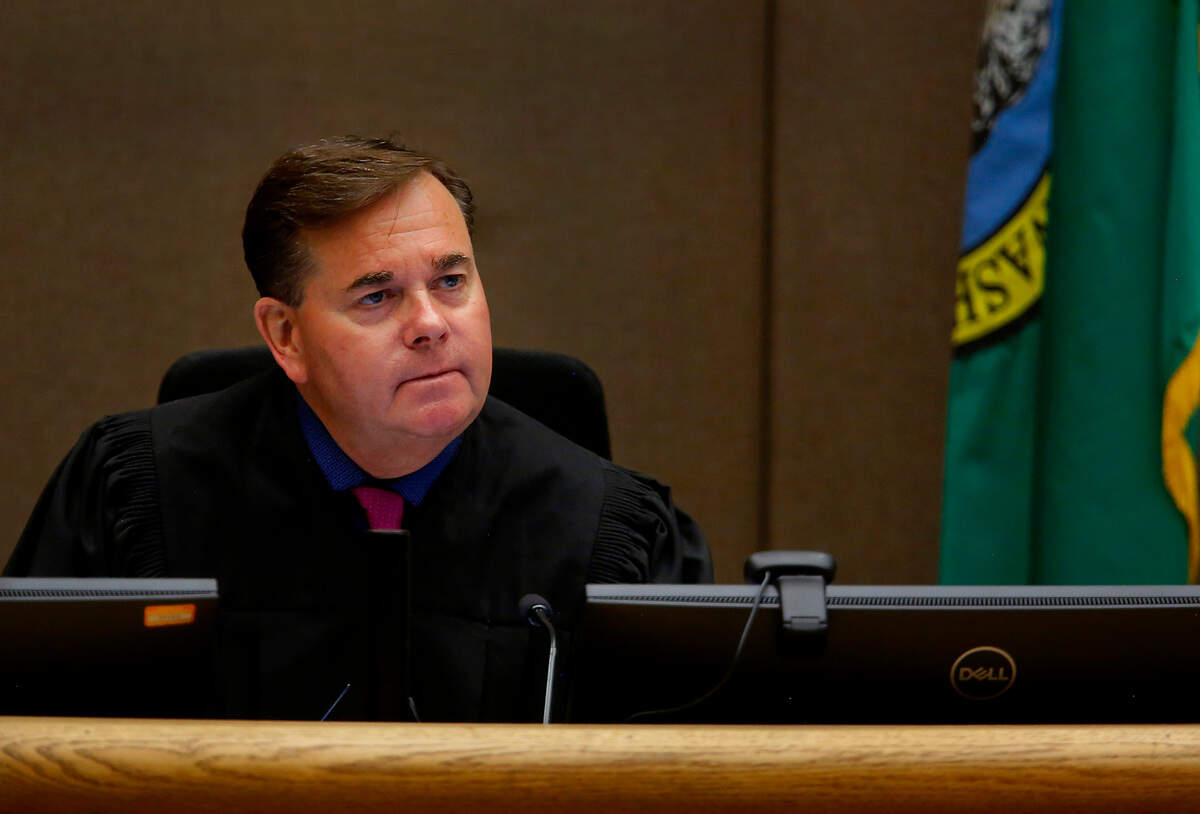 Superior Court Judge Joseph Burrowes listens to a case in a Benton County courtroom at the justice center in Kennewick.