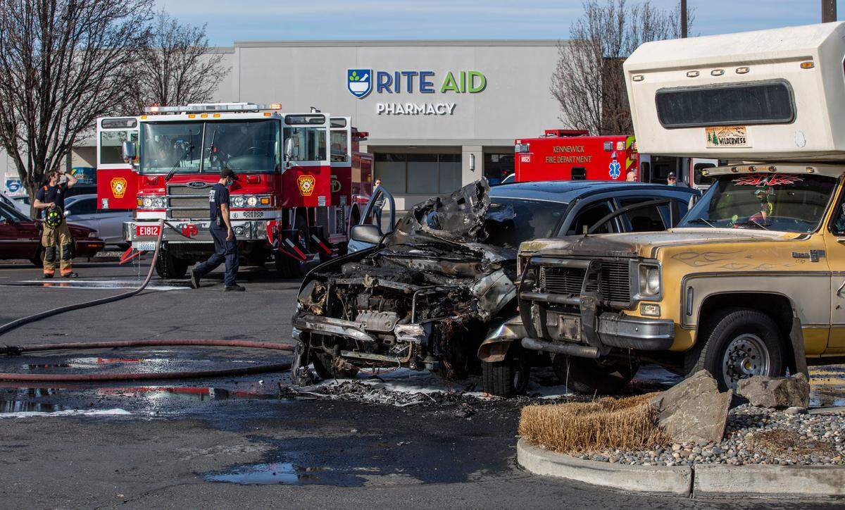 An unconscious man was pulled from a burning car in the Rite Aid parking lot on Ely Street in Kennewick, WA, on Monday morning.