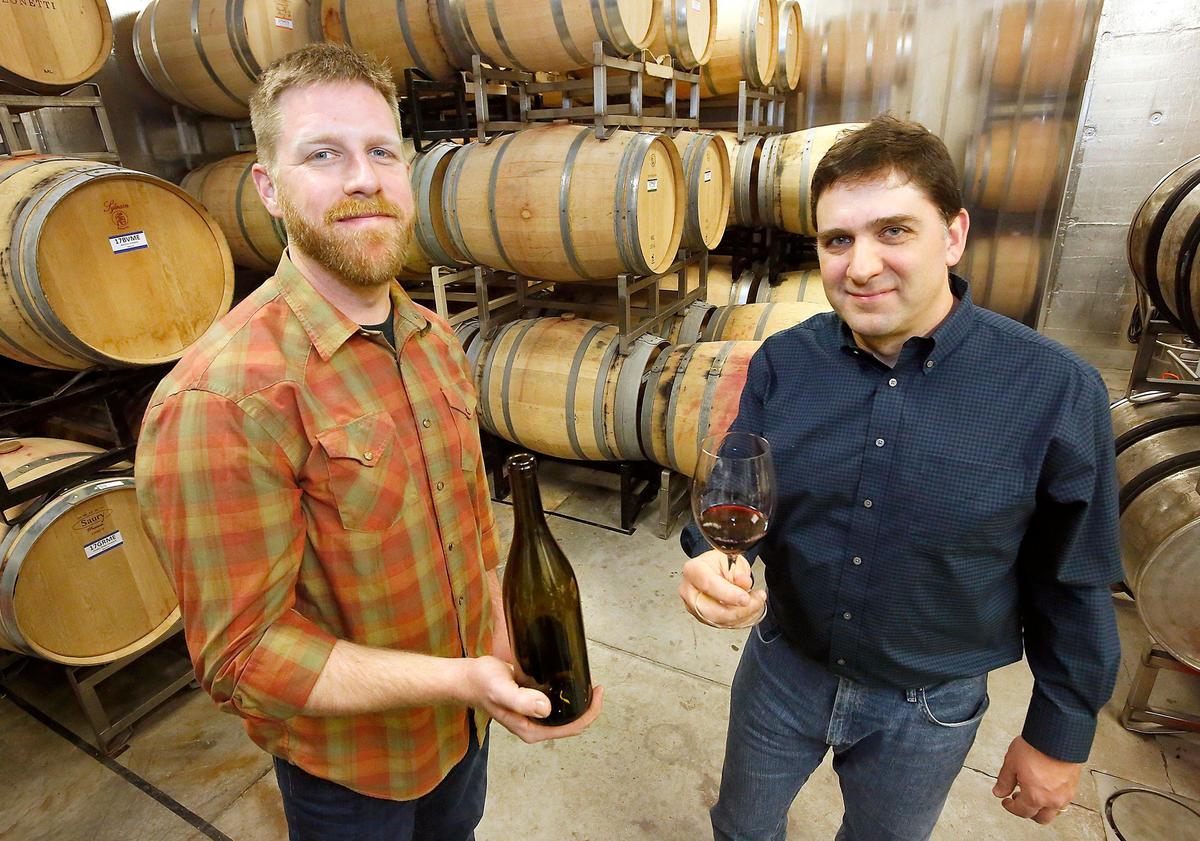 Matt Reilly, left, and Jay Krutulis of Prospice Wines in Walla Walla have five different wines ready for release in early May but the partial federal government shutdown has caused a logjam for them to get their new wine bottle labels approved. Watch a video at: tricityherald.com/video