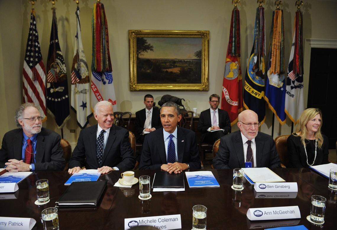 Attorney Kathy Ruemmler, formerly of Richland, right, sits in January 2014 with U.S. President Barack Obama and Vice President Joe Biden at the Presidents Commission on Election Administration in the Roosevelt Room of the White House.