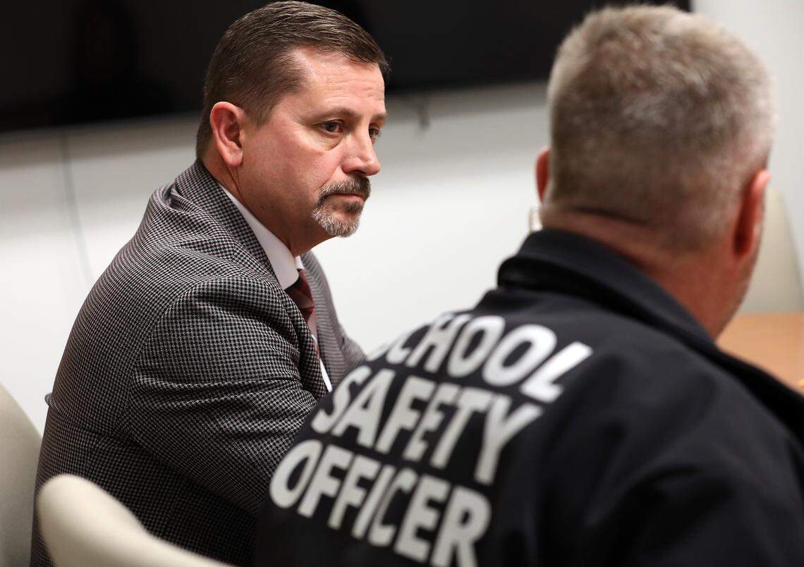 Kennewick School Superintendent Lance Hansen, left, and Scott Child, school safety and security manager, discuss the school district's school safety officer program.