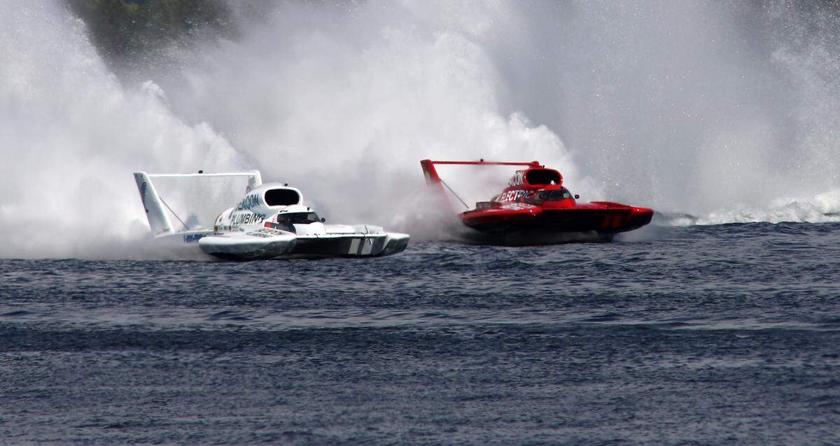 Racing teammates Corey Peabody, left, and J. Michael Kelly mix it up coming out of turn four during Heat 2B of the Columbia Cup unlimited hydroplane race on the Columbia River in the Tri-Cities in 2023.